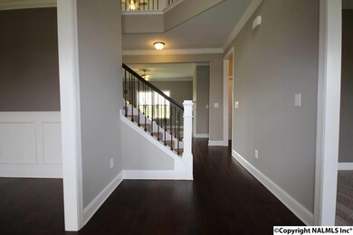 Study and Dining room flank this elegant foyer