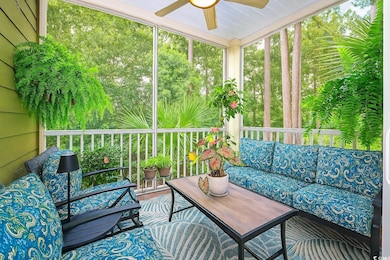 Sunroom featuring a ceiling fan, outdoor lounge area, and plenty of natural light