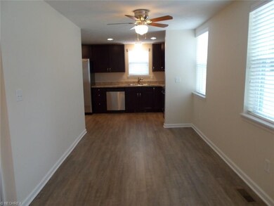Dining area and Kitchen.  High end laminate flooring throughout main living areas.