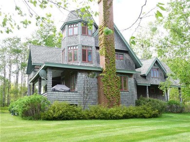 Exterior Front. View of side yard.