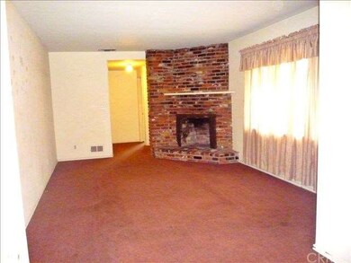 Living room with brick fireplace