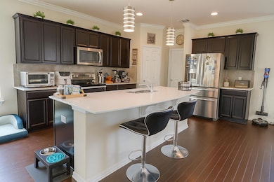 Kitchen featuring appliances with stainless steel