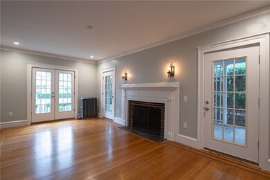 Living room with oversized fireplace, leading to c