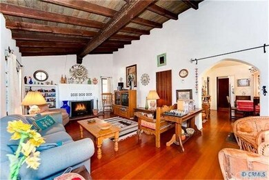 Living room with wood beamed ceilings