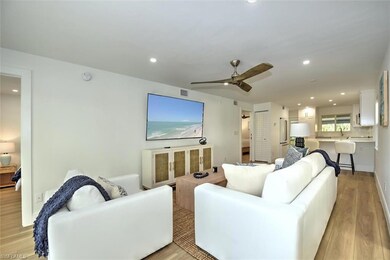 Living area featuring light wood finished floors, recessed lighting, and a ceiling fan