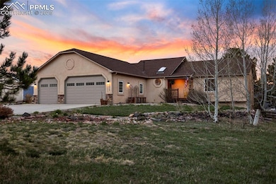 Single story home featuring driveway, stone siding