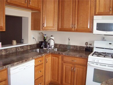 Kitchen with pass through window to Dining Room