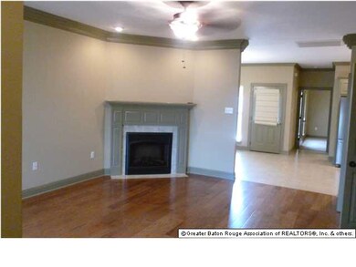The living room is spacious and has an unique orne