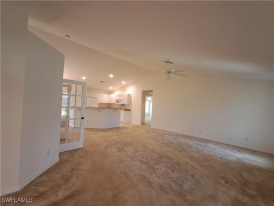 Unfurnished living room with lofted ceiling, healt