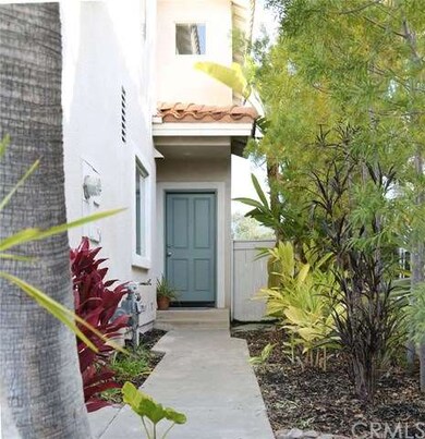 Sidewalk to front door and gate to side yard.