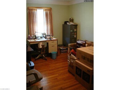THIRD BEDROOM USED AS AN OFFICE WITH HARDWOOD FLOORING