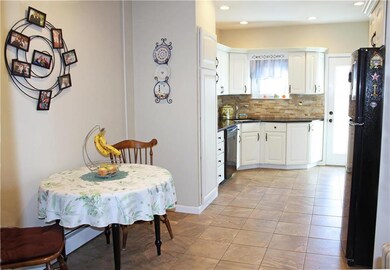 Eat-in kitchen with granite and Corian countertops