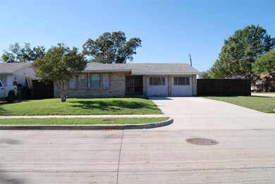 Ranch-style home featuring a front yard