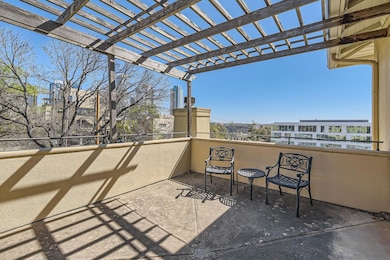 View of patio / terrace with a pergola and a balc