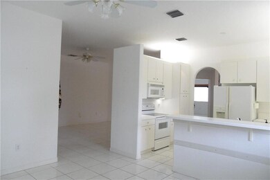 KITCHEN FROM FAMILY ROOM WITH BRKFST BAR