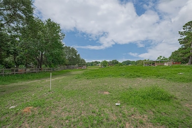 Spacious, open plot of land with lush greenery and