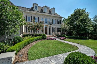 The irrigation system keeps the landscaping  both luxurious and inviting when entering this grand  2-story home. 