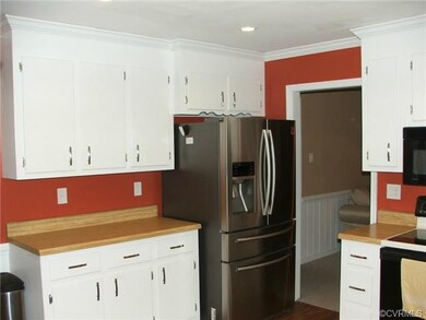 Kitchen with recessed lighting and crown molding, 