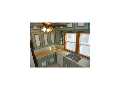 Kitchen. Tons of cabinet space, brightly lit kitch