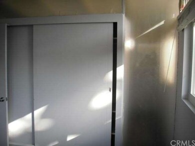 Bedroom one original closet and glass in walls sti