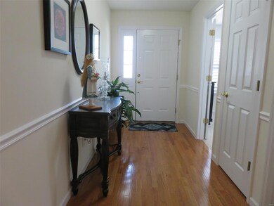Entry foyer with beautiful wood flooring