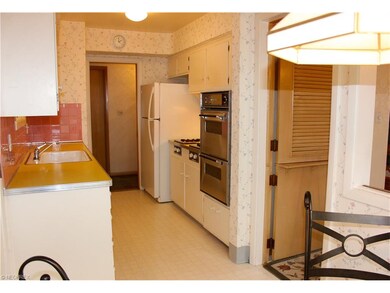 DUTCH DOOR OPENS INTO DINING  LIVING ROOM AREA.