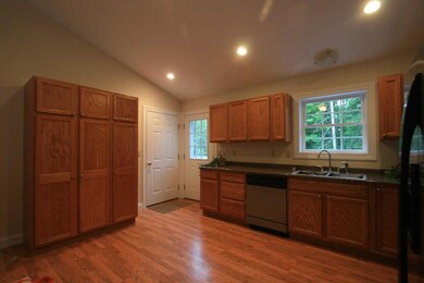 Kitchen open to living room features...