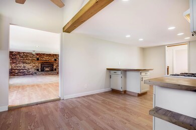 Opens up to Dining and Living Room