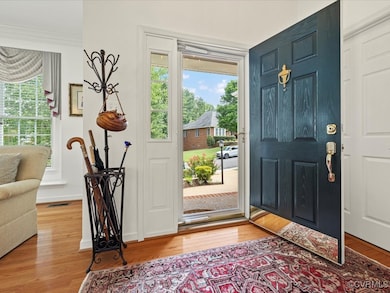 Vaulted Entry with Hardwood Floors