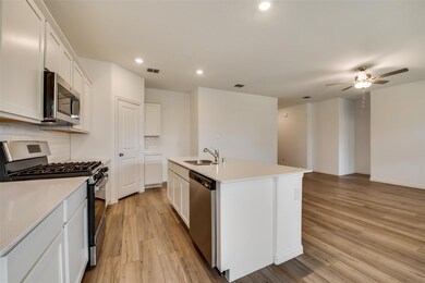 Kitchen featuring stainless steel appliances, visi