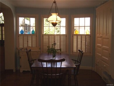 Eating area with full bay window and custom wood b