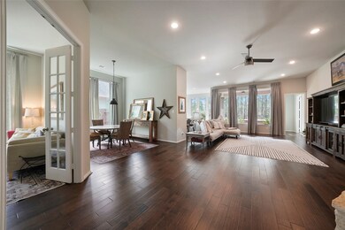 You are going to love this fabulous open floor plan filled with beautiful wood floors, soft neutral paint, upgraded lights and fans in raised ceilings, and spectacular views of the wooded greenbelt behind the home.