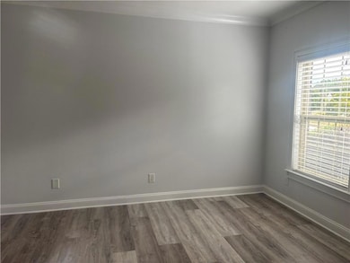 Living room space with Upgraded LVP Flooring.