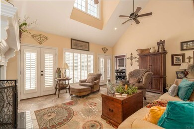 THE HIGH CEILINGS MAKE THE FAMILY ROOM FEEL HUGE