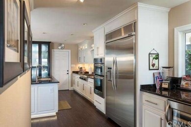 Gorgeous kitchen with wine refrigerator.