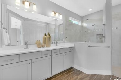 Full bath with double vanity, a walk in shower, a 