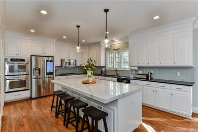 Spacious updated kitchen with large quartz island.