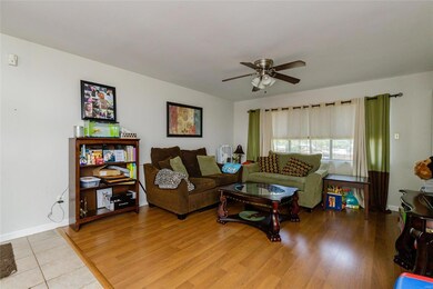 Living room with laminate flooring.