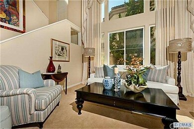 Living room with 2 story ceilings and lots of ligh