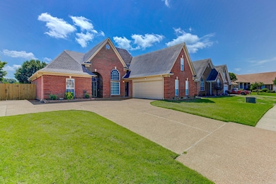 View of front of house featuring brick siding, dri