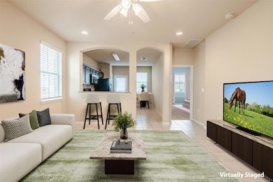 Living area with light tile patterned floors, cei