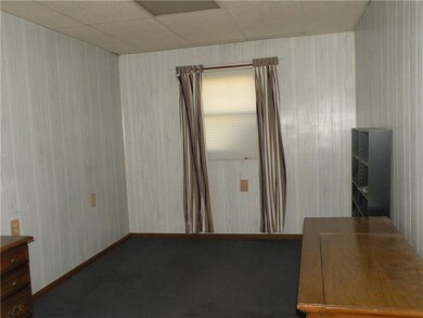 Den just off kitchen could be easily converted int