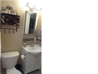 New bathroom with tiled floor.