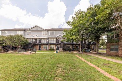 View of front of house featuring stairs, a front l