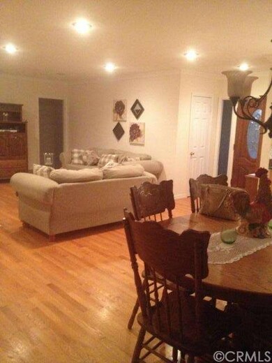 Large entry, gleaming real hardwood floors.