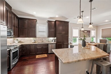 Kitchen featuring appliances with stainless steel