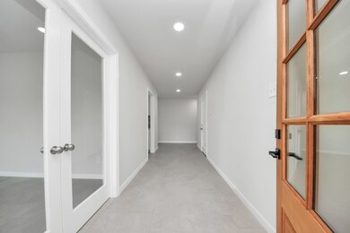 Upon entry, you're greeted by a wide hallway. To t