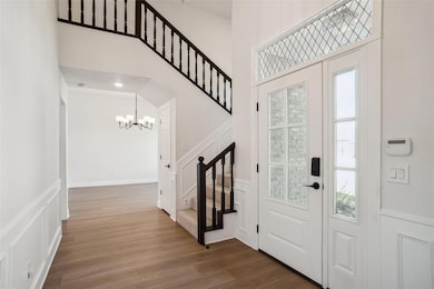 Foyer entrance featuring wood finished floors, a c