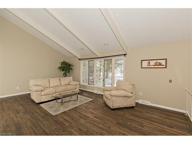 Spacious Living Room with Vaulted Beamed Ceiling a