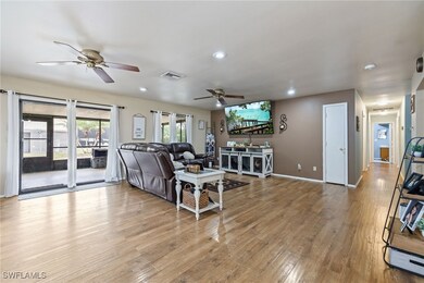 Living room featuring light wood-type flooring, re
